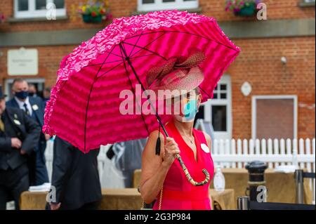 Ascot, Berkshire, UK. 17th June, 2021. Racegoers arriving on Ladies Day at Royal Ascot. After a heatwave over the past few days there is a yellow weather warning of thunderstorms today. Credit: Maureen McLean/Alamy Live News Stock Photo