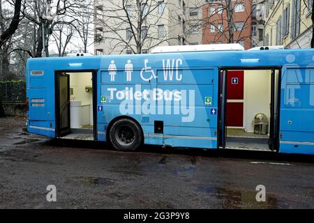 toilet bus in a public city park, in Milan. Stock Photo