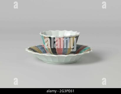 Bell-Shaped Cup and Saucer with a Chinese Lady in A Garden and Diaper Patterns on Various Colored Grounds. Bell-shaped cup and saucer of porcelain with ribbed wall and scalloped edge, painted on the glaze in blue, red, pink, green, yellow, black and gold. On the platter of the dish a Chinese lady (long lice) sitting on a rock in a fenced garden with flowering plants; The edge divided into narrow courses with napkin on different colored backgrounds. The head with the same decoration. Head has been broken. Family Rose. Stock Photo