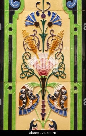 Ceramics with hand painted traditional patterns. Detail of the traditional tiles azulejos from facade of old house in Lisbon, Po Stock Photo