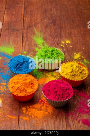 Holi color powder. Organic Gulal colours in bowl for Holi festival, Hindu tradition festive. Blue, pink, magenta, orange, yellow Stock Photo