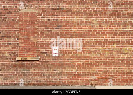 Old brick wall on exterior of building in small Midwest town. Stock Photo