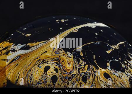 Beautiful psychedelic abstractions on the surface soap bubbles. Stock Photo