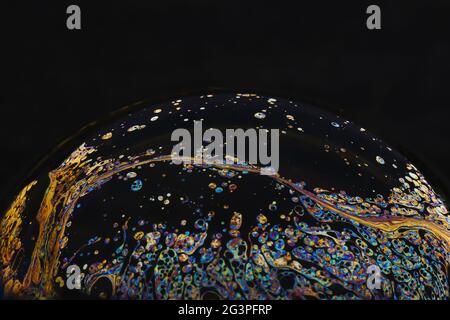 Beautiful psychedelic abstractions on the surface soap bubbles. Stock Photo