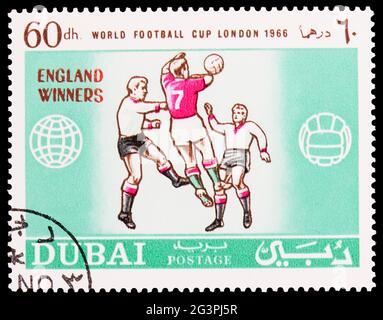 MOSCOW, RUSSIA - MARCH 22, 2020: Postage stamp printed in Dubai shows Football players, Football World Cup, England serie, 60 United Arab Emirates riy Stock Photo