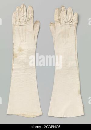 Glove from white leather. White leather glove with three lines on the back. At the wrist a split with three buttons whose pearl-colored the other two worn down. Stock Photo