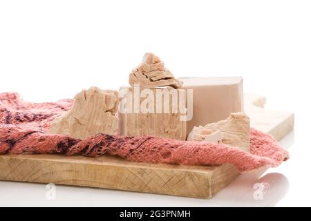 Fresh yeast blocks on wooden board. Stock Photo