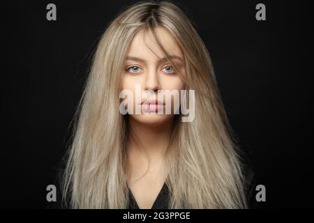 Beautiful young blonde girl with tousled hair Stock Photo