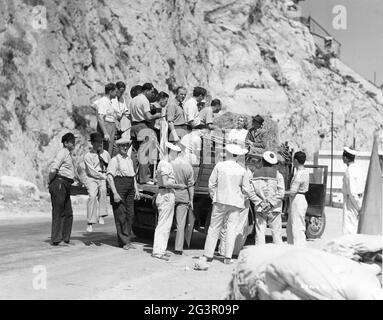 JOHN MILLS and LILLI PALMER on set location candid in France with Director HERBERT MASON and Film Crew during filming of THE FIRST OFFENCE aka BAD BLOOD 1936 director HERBERT MASON writers Stafford Dickens Austin Melford Cinematographer Arthur Crabtree music Allan Gray and Franz Waxman producer Michael Balcon Gainsborough Pictures / Gaumont British Distributors Stock Photo