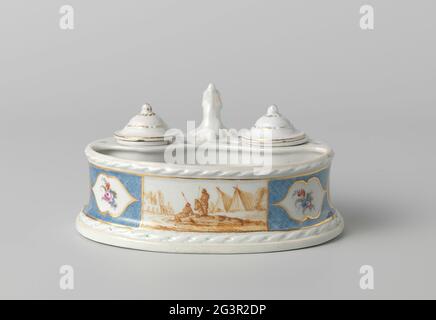 Ink set, painted with a landscape with figures at tents. Porcelain ink set. Oval with ear on one side. In the portion closed at the top Two large round openings for an inkwell and a sand spreader and four holes for pens. A braided ribbon motif in relief along the top and bottom edge. Painted to the front with a landscape with figures at tents in sepia in a rectangular field, which interrupts a fries from light blue grille. In this railing, three cartouches are saved on the sides, the middle of a medallion with scrunch men's head in sepia, contain the other two peak and a multicolored flower br Stock Photo