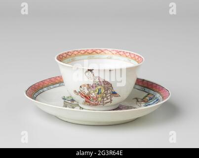 Bell-Shaped Cup and Saucer with a Chinese Lady, Boy and Rabbit. Two bell-shaped heads and a porcelain dish, painted on the glaze in blue, red, pink, green, yellow, purple, black and gold. On the flat of the dish a Chinese lady on a chair with a boy next to her with a rabbit for him; They are surrounded by lucky objects such as a dragon vase, vase with coral and peacock feathers, flower vase, fruit basket, incense burner and a vase with rolls; The inner edge with a decorative bond with napkin. The heads with the same decoration with a ponda branch on the bottom. Dish has been broken; a chip in Stock Photo