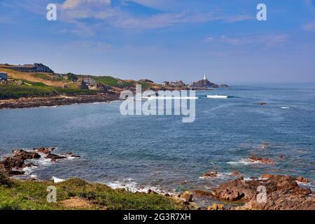 Image of Petit Port Bay with Corbiere Lighthouse in the background. Jersey CI Stock Photo