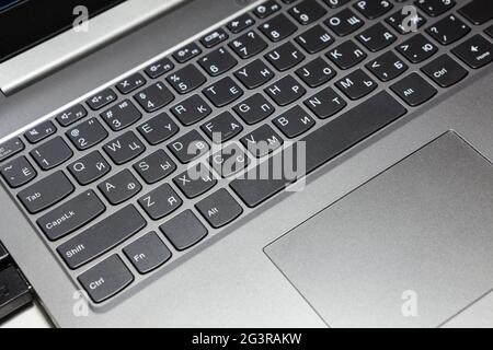 Silver laptop keyboard and touchpad, close up view Stock Photo