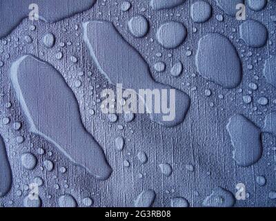 Raindrops on a blue tablecloth blue Stock Photo