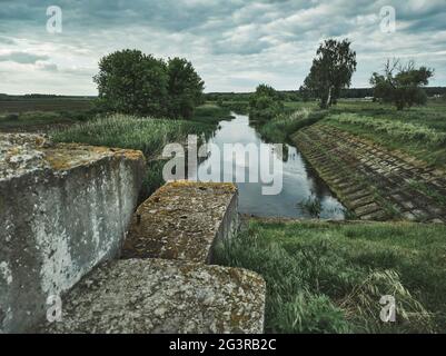 Water flowing in a channel with nature background. . Beautiful landscapes. Beauty in the nature Stock Photo