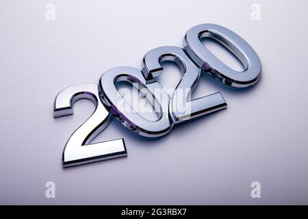 Happy New Year 2020. Symbol from number 2020 on bright background. Silver letters in the form of numbers 2020. Stock Photo