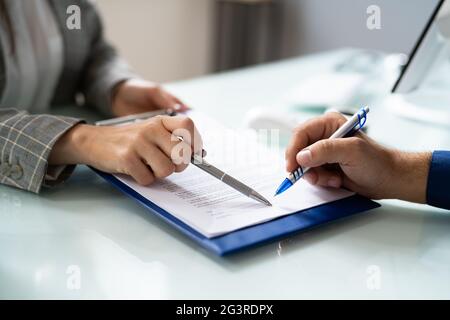 Lawyer Contract Mediation And Review. Two Reading Corporate Document Stock Photo