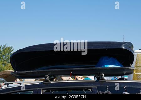 Roof top cargo box on car full with stuff for family vacation Stock Photo