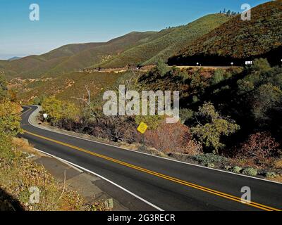 Old Priest Grade, steep grade use low gear sign in Tuolumne County, California Stock Photo