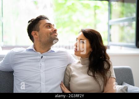 Couple Sitting On Couch Relaxing Breathing Fresh Air Stock Photo