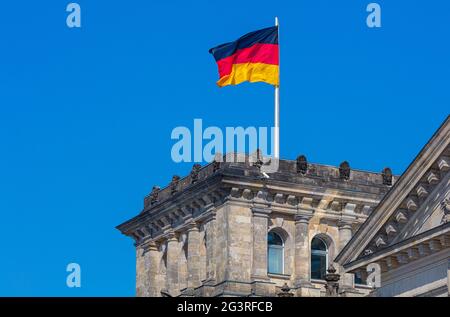 Berlin Reichstag waving a flag in the wind, Federal Republic of Germany, Reichstag, parliament Stock Photo