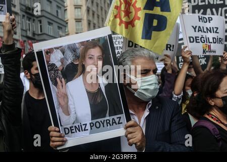 Istanbul, Turkey. 17th June, 2021. A protester holds a placard with a photo of Deniz Poyraz, who was killed in an armed attack on the headquarters of the Peoples' Democratic Party in Izmir during a demonstration.People held a protest against Armed Attack on Peoples' Democratic Party Izmir Office, the armed attacker Onur Gencer, who came to the headquarters of the pro-Kurdish Peoples' Democratic Party in Izmir at around 11:00 am today, killed a 40-year-old employee Deniz Poyraz. Credit: SOPA Images Limited/Alamy Live News Stock Photo