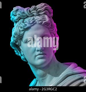 Statue of of Apollo God of Sun. Creative concept colorful neon image with ancient greek sculpture Apollo Belvedere head. Webpunk Stock Photo