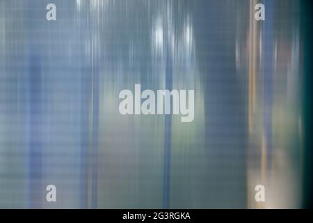 Texture of matte translucent plexiglass with stripes, glare, and reflections. Stock Photo