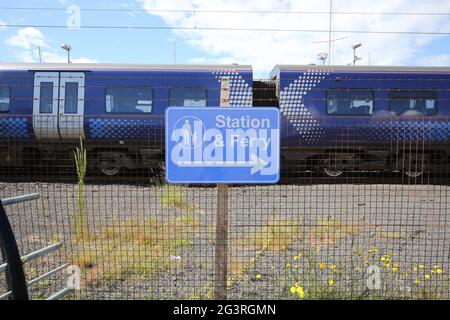 Ardrossan Harbour, North Ayrshire, Scotland, UK. Sign pointing to direction of Railway station & ferry Stock Photo