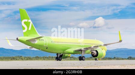 Russia, Vladivostok, 08/17/2020. Passenger plane Airbus A320neo of S7 Airlines on runway after landing in sunny day. Happy journ Stock Photo