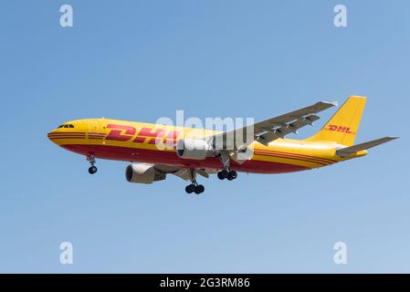 DHL, EAT Leipzig, European Air Transport Leipzig Airbus A300 cargo airliner jet plane D-AEAJ on finals to land at London Heathrow Airport, UK Stock Photo