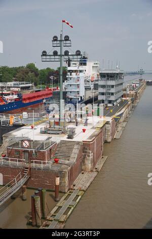 Cruise ship passes the Holtenau lock of the Kiel Canal to continue their journey to the Baltic Sea. Stock Photo