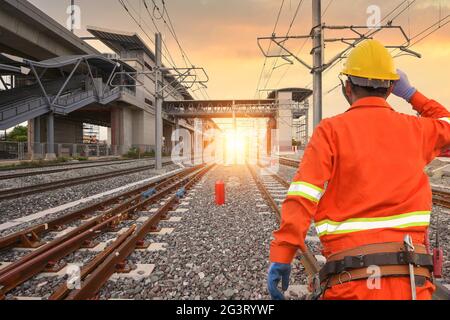 Electricians are climbing on electric poles to install and repai Stock Photo