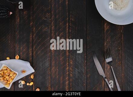 Decorated cutlery, fork and knife on a blue napkin. Mockup Stock Photo