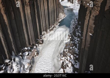 Studlagil canyon snowed from aerial view Stock Photo