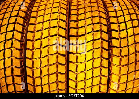 Gold tire tread close-up.The concept of expensive car maintenance. Stock Photo