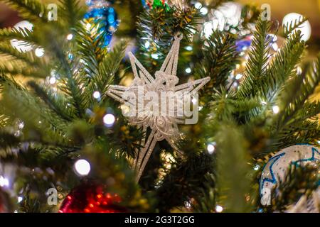 Christmas background with decorative star, fir branches and pine cones Stock Photo