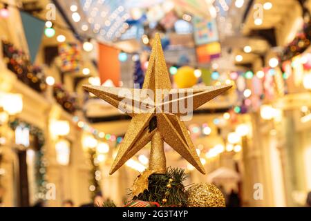 Christmas background with decorative star, fir branches and pine cones Stock Photo