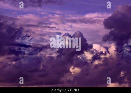 Gorgeous dramatic sunset sky with pink and purple clouds. Stock Photo