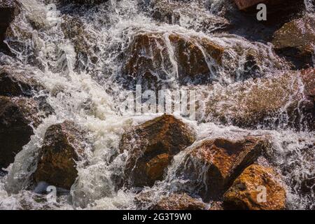 Water cascading over rocks from a recent rainstorm. Sellar's Gulch area, Castle Rock Colorado USA. Photo was taken in May. Stock Photo
