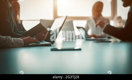 Link build developers testing usability of a new program or website with different operation system laptops in the modern office Stock Photo