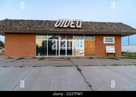 Tucamcari, New Mexico - May 6, 2021: Abandoned old video store, closed and boarded up along Route 66 Stock Photo