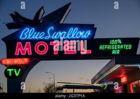 Tucamcari, New Mexico - May 6, 2021: Close up of the Blue Swallow Motel neon sign, a famous classic Route 66 motel Stock Photo