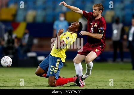 Goiania, Brazil. 17th June, 2021. Colombia's Yerry Mina (L) vies with Venezuela's Fernando Aristeguieta during the 2021 Copa America Group B football match in Goiania, Brazil, June 17, 2021. Credit: Lucio Tavora/Xinhua/Alamy Live News Stock Photo