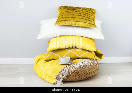 Pink and white pillows on the wall background. Close up Stock Photo