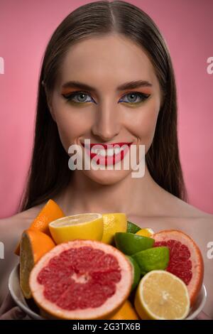 fashion lady with long orange red hair walking in the fall city park