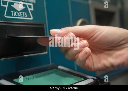 Closeup hand with train ticket from self service machine Stock Photo