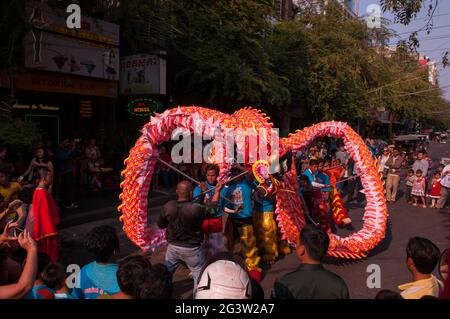a crowd watches traditional 'dragon dancing' during Chinese New Year, 'Year of the Dog', in Phnom Penh, Cambodia. credit: Kraig Lieb