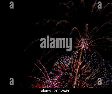 Fireworks display in night sky for holiday or special occasions. Stock Photo