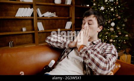 The young man drinking wine at home Stock Photo - Alamy